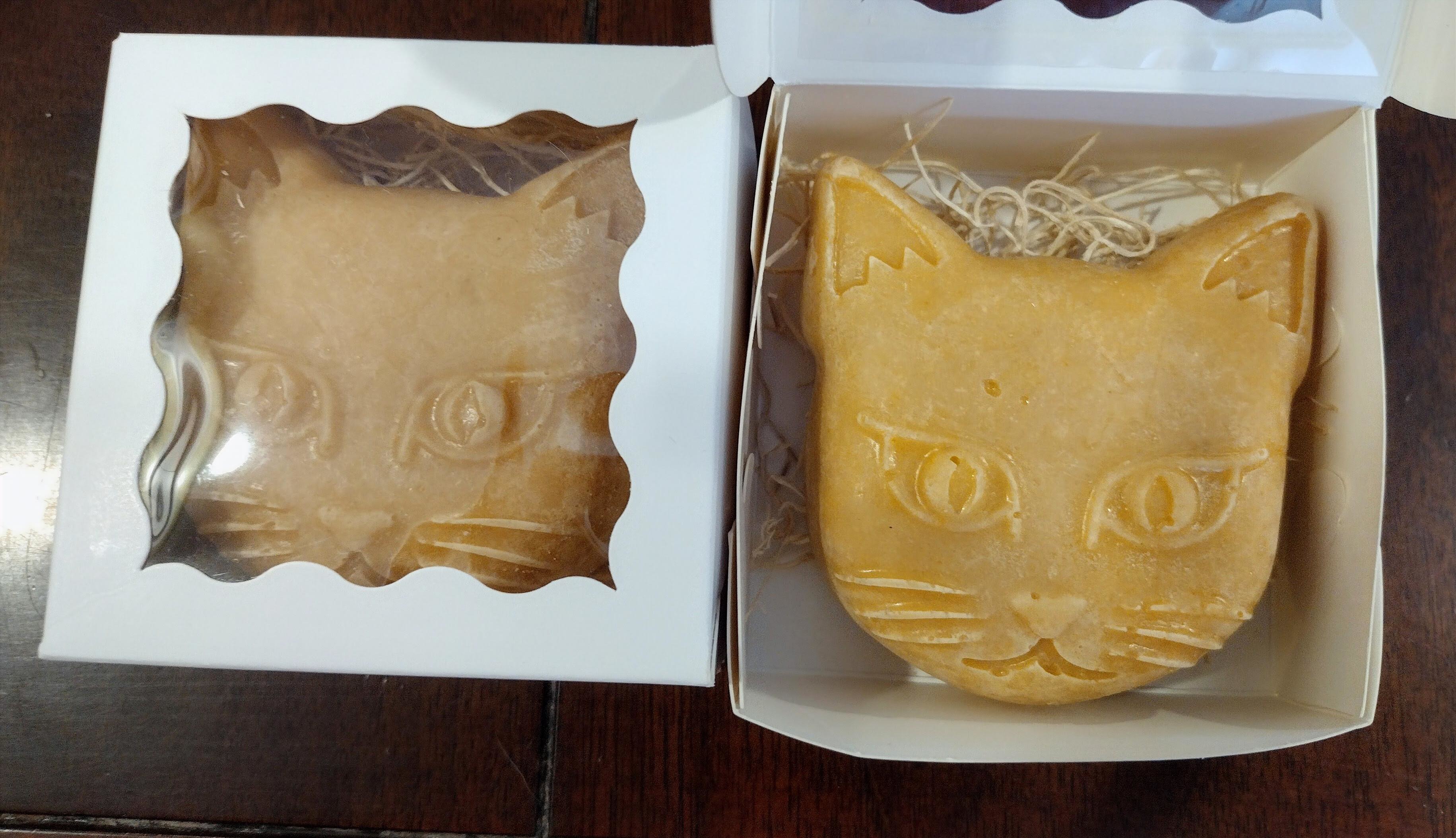 orange cat face shaped soap in a box